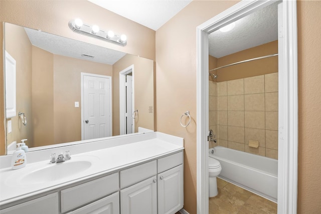 4838 Fair Oak Dale Ln, Humble, TX 77346 - full bath with vanity, tub / shower combination, a textured ceiling, and tile patterned floors