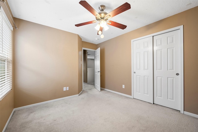 4838 Fair Oak Dale Ln, Humble, TX 77346 - unfurnished bedroom featuring light colored carpet, a closet, and a ceiling fan