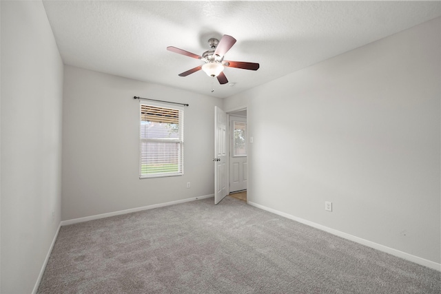 4838 Fair Oak Dale Ln, Humble, TX 77346 - spare room featuring a ceiling fan, carpet, and a textured ceiling