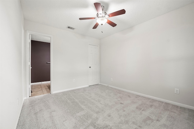 4838 Fair Oak Dale Ln, Humble, TX 77346 - unfurnished bedroom with carpet floors, ensuite bathroom, and ceiling fan