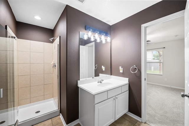 4838 Fair Oak Dale Ln, Humble, TX 77346 - full bath with a stall shower, vanity, a textured wall, and tile patterned floors