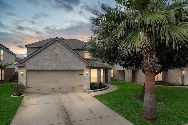 4838 Fair Oak Dale Ln, Humble, TX 77346 - view of front of home with a front yard, concrete driveway, a garage, brick siding, and roof with shingles