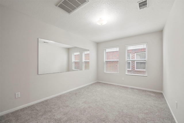 4838 Fair Oak Dale Ln, Humble, TX 77346 - carpeted spare room featuring plenty of natural light and a textured ceiling