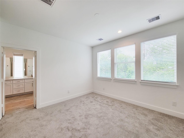 6735 Cohn St, Houston, TX 77091 - spare room with light colored carpet and baseboards