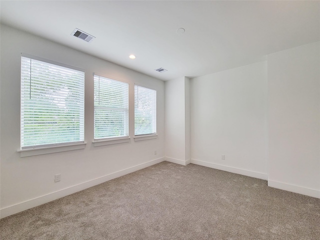 6735 Cohn St, Houston, TX 77091 - spare room featuring light carpet and recessed lighting