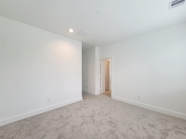 6735 Cohn St, Houston, TX 77091 - empty room with light carpet and recessed lighting