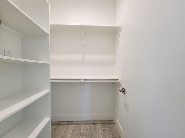 6735 Cohn St, Houston, TX 77091 - walk in closet featuring wood finished floors