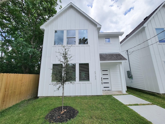 6735 Cohn St, Houston, TX 77091 - view of front of house featuring board and batten siding and roof with shingles