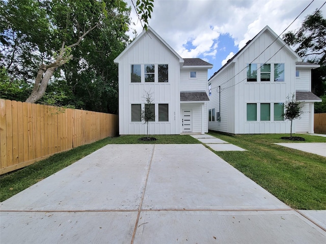 6735 Cohn St, Houston, TX 77091 - modern farmhouse featuring board and batten siding and a shingled roof