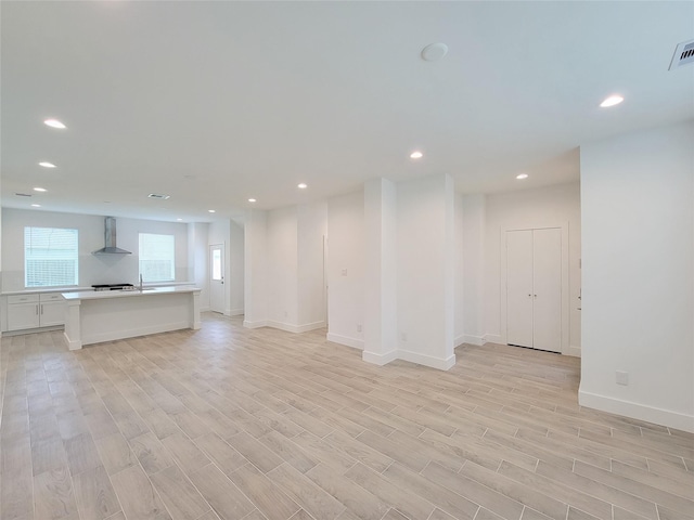 6735 Cohn St, Houston, TX 77091 - unfurnished living room featuring recessed lighting and light wood finished floors