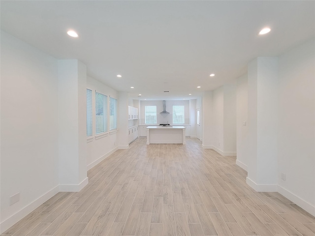 6735 Cohn St, Houston, TX 77091 - unfurnished living room with light wood-style flooring and recessed lighting