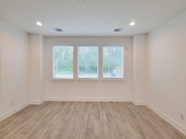 6735 Cohn St, Houston, TX 77091 - unfurnished room with light wood-type flooring and recessed lighting