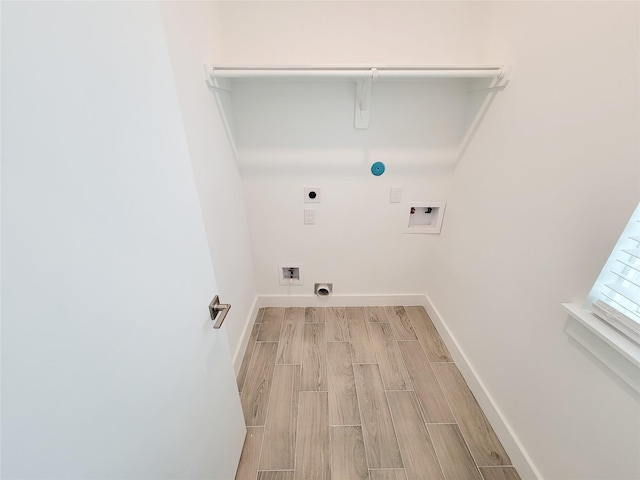 6735 Cohn St, Houston, TX 77091 - washroom with hookup for an electric dryer, washer hookup, and wood tiled floors