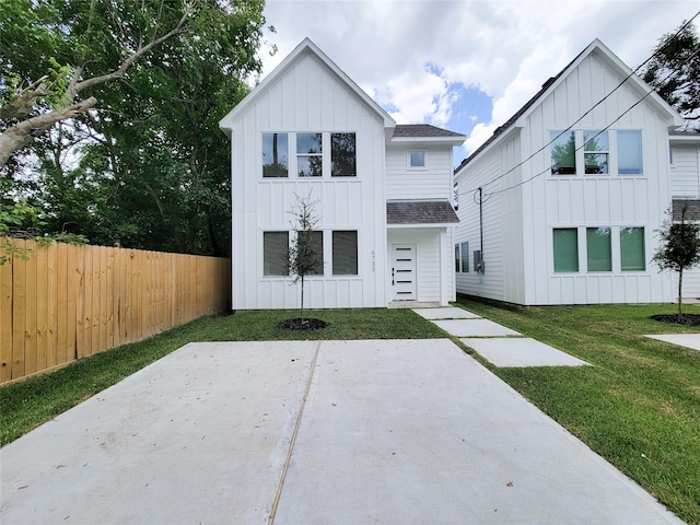 6735 Cohn St, Houston, TX 77091 - view of front of home featuring board and batten siding, roof with shingles, and a patio area