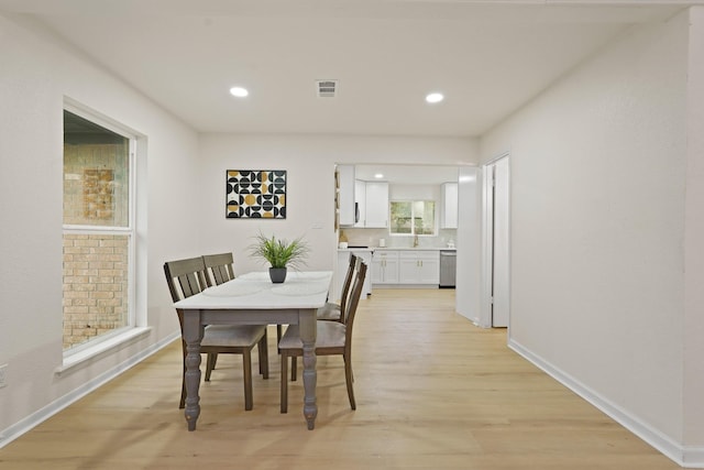 3351 S Sutton Sq, Stafford, TX 77477 - dining space featuring light wood finished floors and recessed lighting