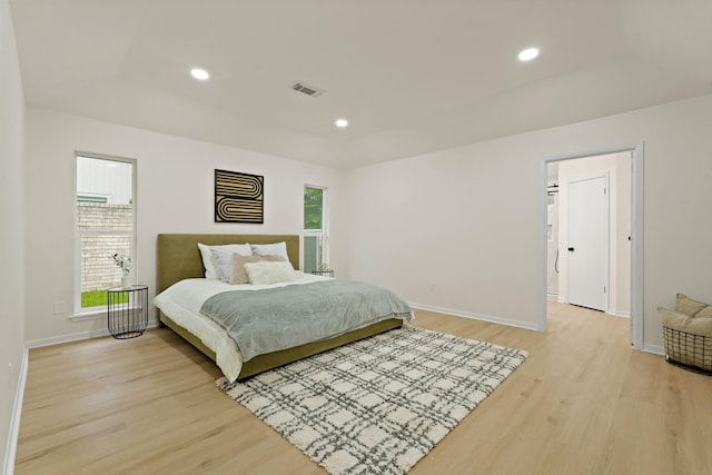 3351 S Sutton Sq, Stafford, TX 77477 - bedroom featuring light wood finished floors, recessed lighting, and a tray ceiling