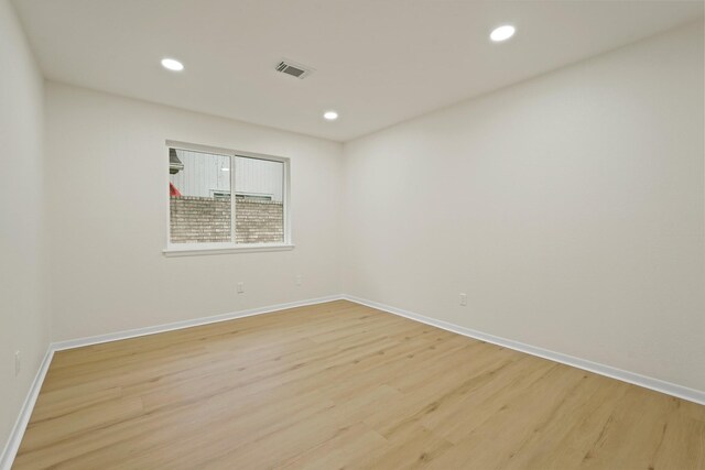 3351 S Sutton Sq, Stafford, TX 77477 - spare room featuring light wood-type flooring and recessed lighting