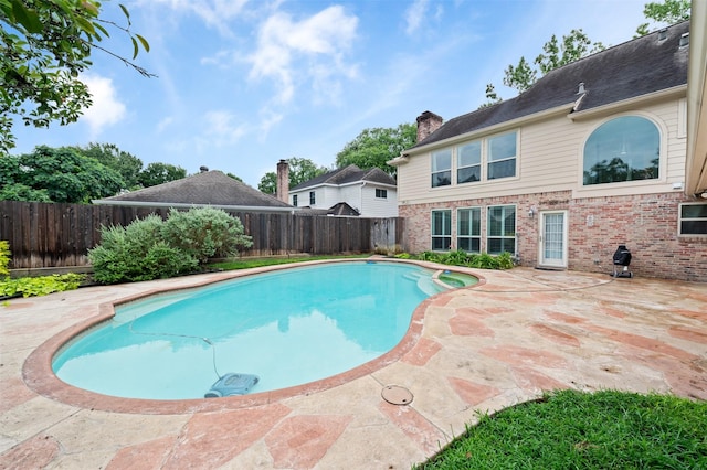20234 Brondesbury Dr, Katy, TX 77450 - view of swimming pool with a fenced backyard, a patio, and a pool with connected hot tub