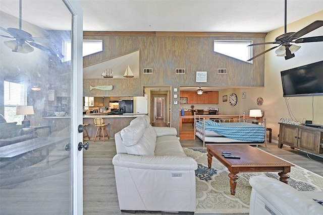 206 Galleon Dr, Freeport, TX 77541 - living area with ceiling fan, wood finished floors, and a towering ceiling