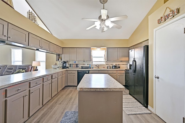 206 Galleon Dr, Freeport, TX 77541 - kitchen featuring black appliances, gray cabinets, lofted ceiling, ceiling fan, and light wood-type flooring