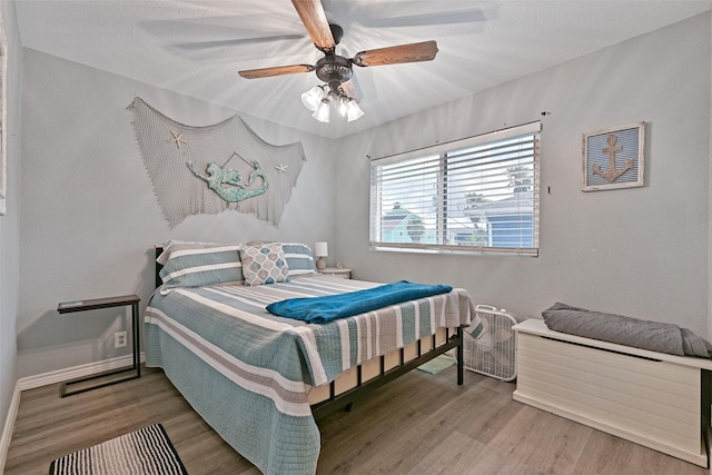 206 Galleon Dr, Freeport, TX 77541 - bedroom with wood finished floors and ceiling fan