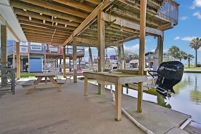 206 Galleon Dr, Freeport, TX 77541 - view of patio featuring a water view, boat lift, and a dock
