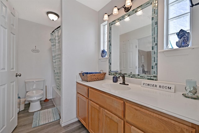 206 Galleon Dr, Freeport, TX 77541 - bathroom with vanity, wood finished floors, and shower / bath combo