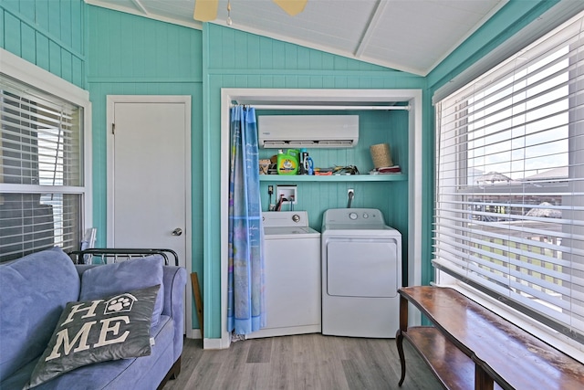 206 Galleon Dr, Freeport, TX 77541 - laundry area featuring separate washer and dryer, wood finished floors, an AC wall unit, and a ceiling fan