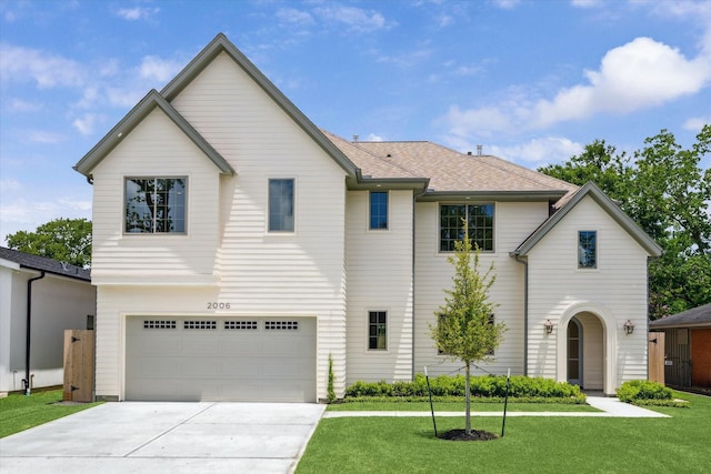 2006 Chantilly Ln, Houston, TX 77018 - view of front of home with concrete driveway, a front yard, and a garage