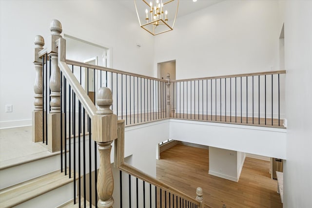 2006 Chantilly Ln, Houston, TX 77018 - stairway with a chandelier and wood finished floors