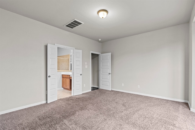 18514 Providence Landing Ln, Richmond, TX 77407 - unfurnished bedroom with light colored carpet and ensuite bath