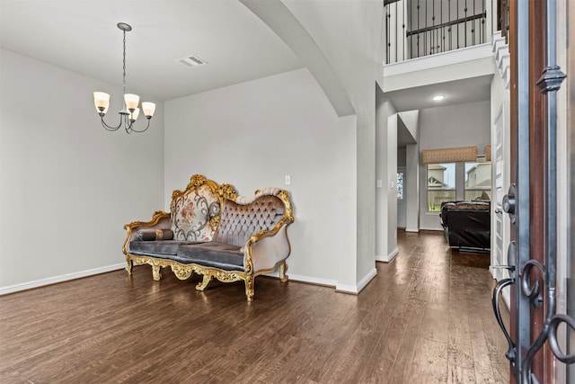18514 Providence Landing Ln, Richmond, TX 77407 - foyer with wood finished floors, arched walkways, and a chandelier