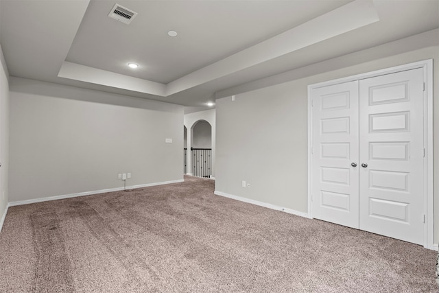 18514 Providence Landing Ln, Richmond, TX 77407 - carpeted spare room with arched walkways and a raised ceiling