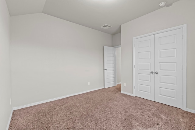 18514 Providence Landing Ln, Richmond, TX 77407 - unfurnished bedroom with carpet, a closet, and lofted ceiling