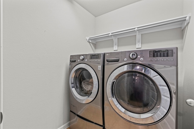 18514 Providence Landing Ln, Richmond, TX 77407 - washroom featuring washing machine and dryer and baseboards