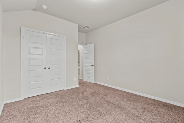 18514 Providence Landing Ln, Richmond, TX 77407 - unfurnished bedroom featuring carpet flooring, a closet, and lofted ceiling