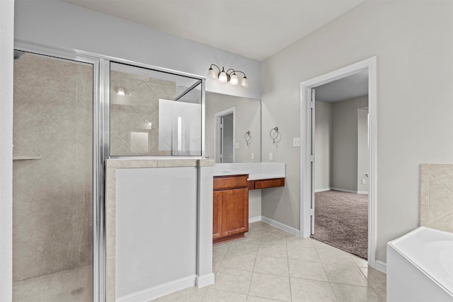 18514 Providence Landing Ln, Richmond, TX 77407 - bathroom featuring vanity, a stall shower, tile patterned flooring, and a garden tub