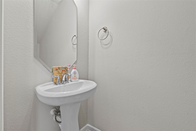 18514 Providence Landing Ln, Richmond, TX 77407 - bathroom with a sink and a textured wall