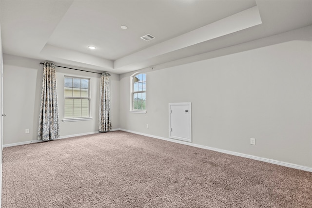 18514 Providence Landing Ln, Richmond, TX 77407 - carpeted spare room featuring a tray ceiling and recessed lighting