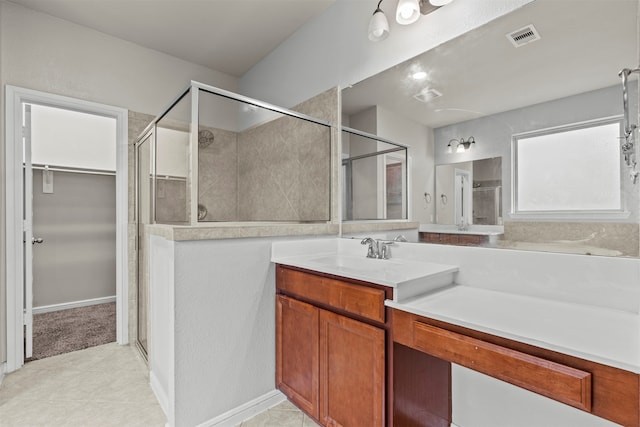 18514 Providence Landing Ln, Richmond, TX 77407 - bathroom featuring vanity, a stall shower, a spacious closet, and tile patterned flooring