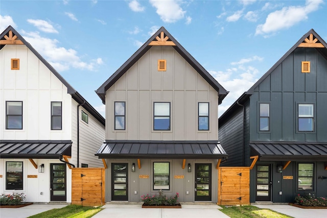 8019 Cora St, Houston, TX 77088 - view of front of home with a standing seam roof, board and batten siding, and a metal roof