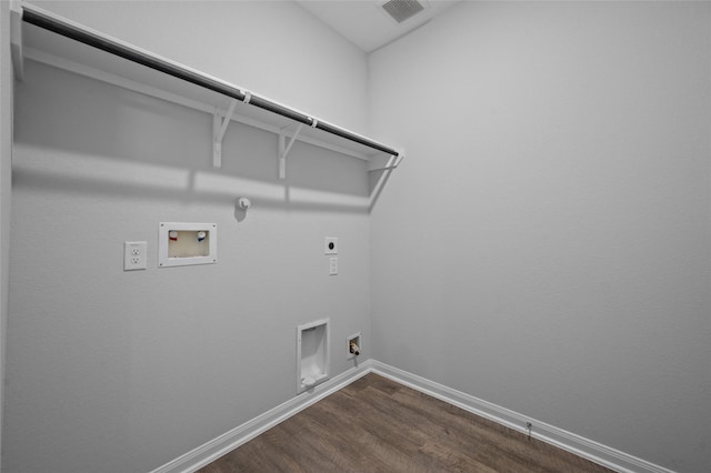 132 Big Sandy Ln, Anahuac, TX 77514 - washroom with hookup for a gas dryer, electric dryer hookup, hookup for a washing machine, and dark wood finished floors