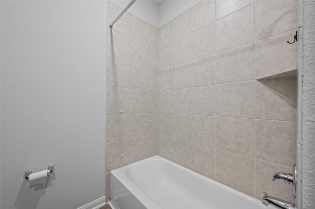 132 Big Sandy Ln, Anahuac, TX 77514 - bathroom with shower / washtub combination and baseboards
