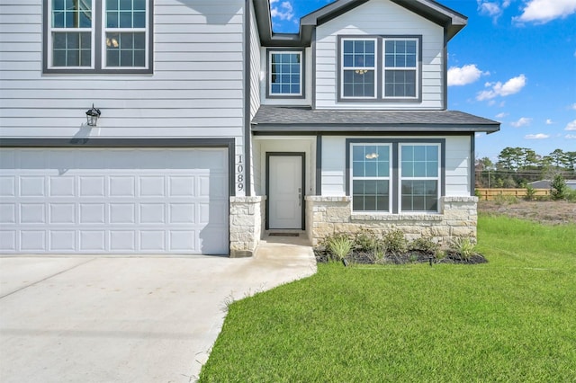 1089 Rd 5740, Cleveland, TX 77327 - view of front facade with stone siding, concrete driveway, a front lawn, a garage, and roof with shingles