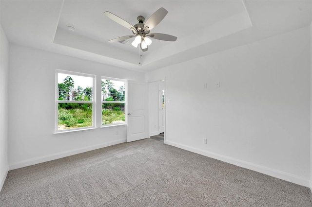 1089 Rd 5740, Cleveland, TX 77327 - unfurnished room featuring a tray ceiling, carpet floors, ceiling fan, and a smoke detector
