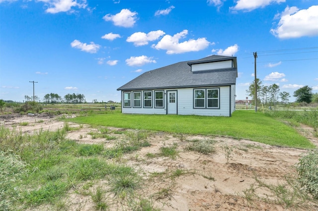 1089 Rd 5740, Cleveland, TX 77327 - rear view of house with a yard and roof with shingles