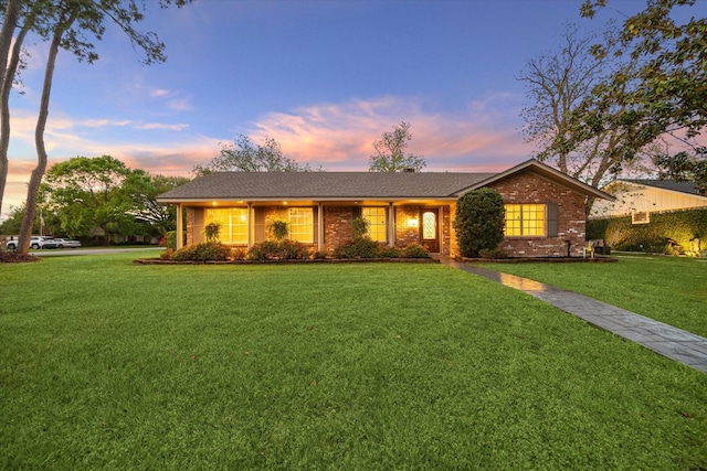 9222 Bronco Dr, Houston, TX 77055 - ranch-style home featuring a lawn and brick siding