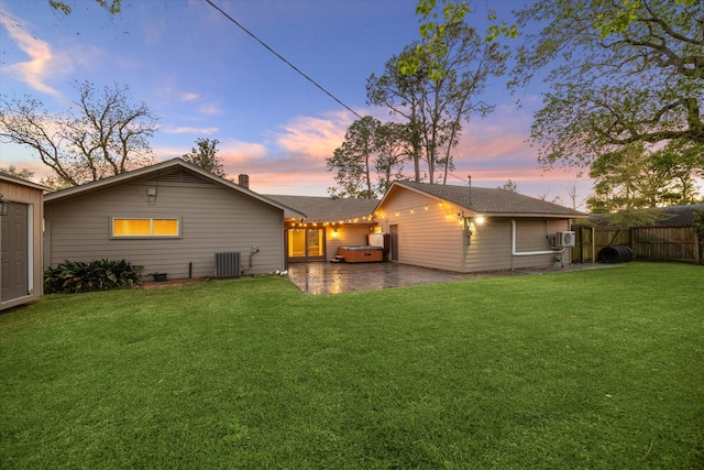 9222 Bronco Dr, Houston, TX 77055 - back of house at dusk featuring a patio area