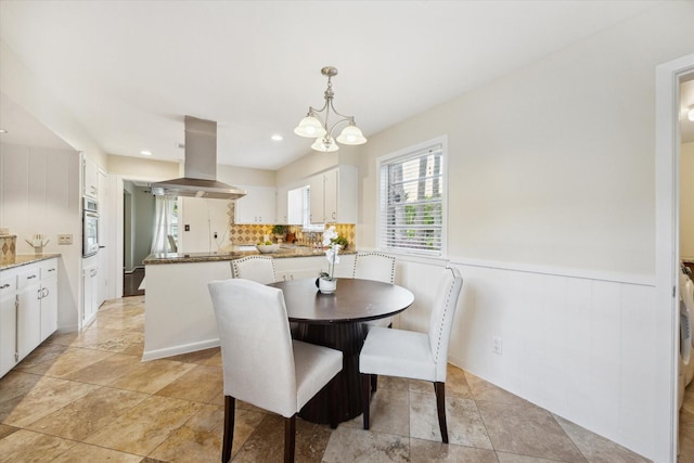 9222 Bronco Dr, Houston, TX 77055 - dining room with wainscoting, a chandelier, and recessed lighting