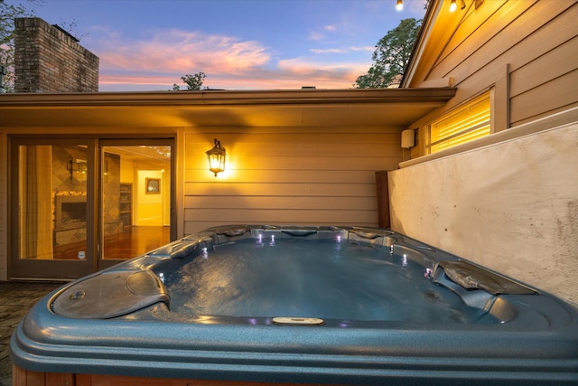 9222 Bronco Dr, Houston, TX 77055 - view of patio / terrace with a hot tub